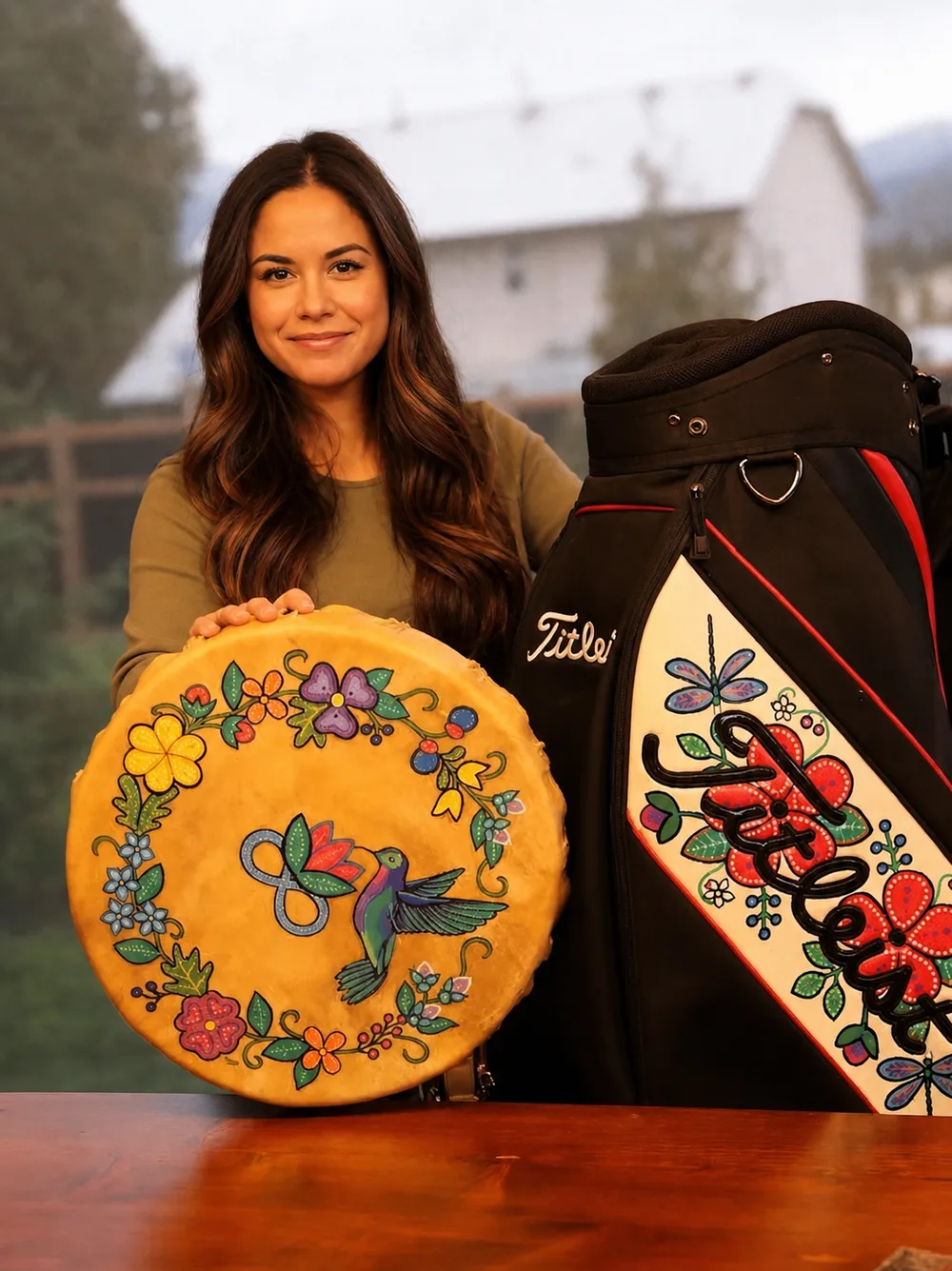 Michelle with a painted drum and a hand-painted golf bag